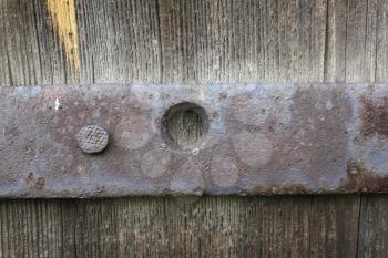 Old wooden door with bolt and nut 19961