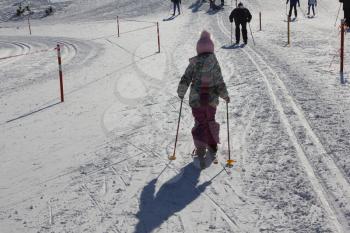Young girl skiing on a ski track 30329
