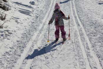 Young girl skiing on a ski track 30352