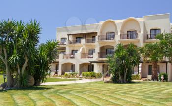 Tropical Hotel and palm trees, lawns and pathway