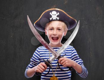 Little pirate boy with cutlass