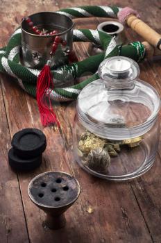 accessories to smoking hookah and dry tea leaves.