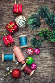 Spools of thread and beads in Christmas songs in vintage style.