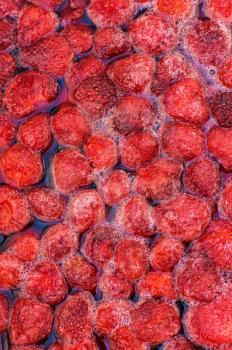 The process of making strawberry jam from fresh berries
