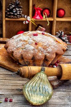 cupcake baked for new year holiday on wooden table on  background of Christmas decorations.