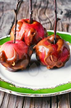 apples with toffee caramel decorated with branch