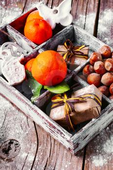 Vintage light box with Mandarin,hazelnuts and packaged gift