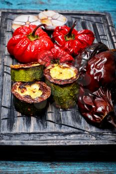 Baked eggplant,peppers and garlic on the kitchen board