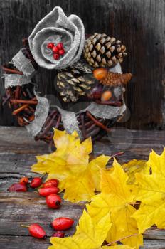 Leaf and handmade wreath of vines with pine cone