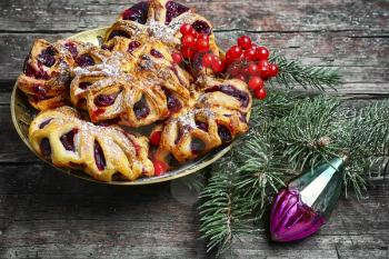 Christmas bun with jam with Christmas tree and decorations