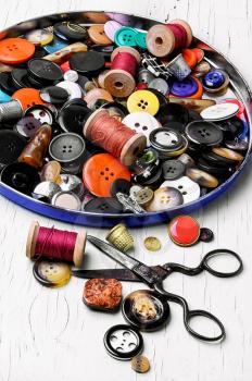 Threads for sewing and a set of buttons from clothing