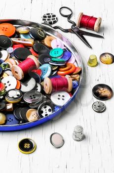 Threads for sewing and set of buttons from clothing