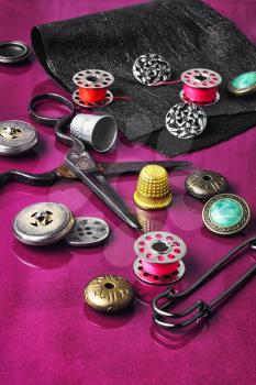 Set of beautiful buttons,sewing needle and bobbin