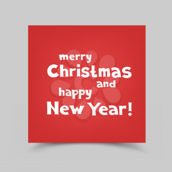 The colored red piece of paper with the message of Christmas greetings on gray background