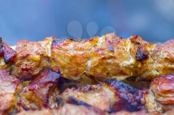 Barbecue shish kebab cook. Tasty grill dinner cooking. Food BBQ background. Roasted fresh beef meat