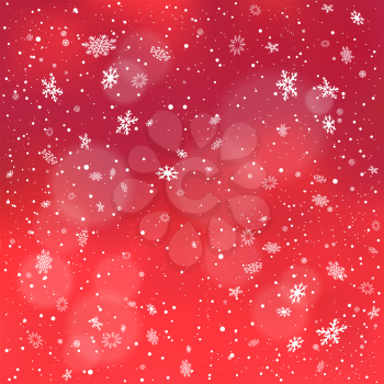 Closeup snowfall on red backdrop. Winter holiday Christmas background. Big and small snowflakes falling from clouds