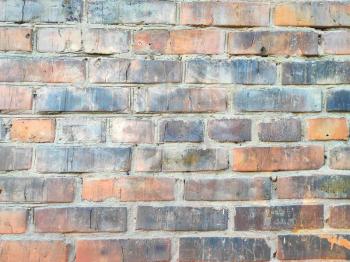 Old brick wall texture background pattern. Black and orange brickwork aged textured backdrop