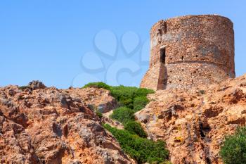 Ancient Genoese tower on Capo Rosso cliff, Corsica island, France