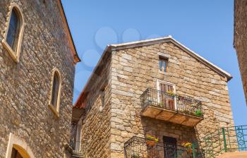 Old stone living houses facades, Sartene, Corsica island, France