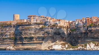 Colorful houses and fortress tower on rocky coast. Bonifacio, Corsica island, France