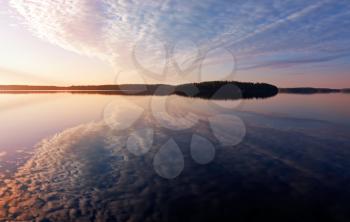 Colorful sunrise. Early morning on the Saimaa lake in Karelia, Finland