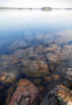 Coastal stones under still clear water on Saimaa lake,  Imatra town, Finland