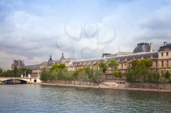 PARIS, FRANCE - AUGUST 07, 2014: Seine river with Louvre museum facade on other side