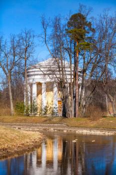 Friendship temple. Round pavilion in Pavlovsk park, spring time. Saint-Petersburg, Russia