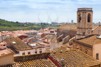 Cityscape of Spanish resort town Calafell in summer, tiling roofs in old part of town
