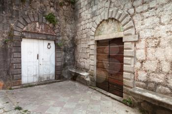 Wooden doors on the street of ancient Perast town, Kotor bay, Montenegro