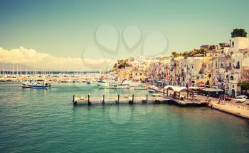 Small Italian town cityscape. Port of Procida island, Gulf of Naples, Italy. Vintage toned photo with old style tonal filter effect