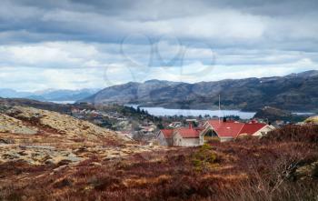 Coastal Norwegian fishing village with colorful wooden houses. Rorvik, Norway