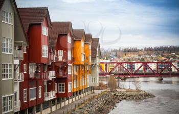 Facades of colorful wooden houses in small Norwegian town