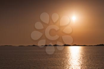 Rising sun over horizon of Bonifacio, Corsica, Corse-du-Sud, France