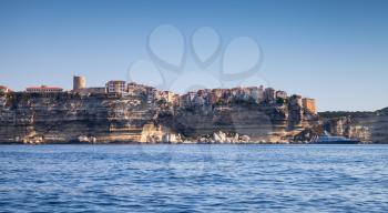 Old town on rocky coast of Bonifacio, mountainous Mediterranean island Corsica, Corse-du-Sud, France