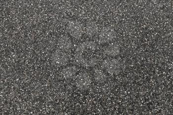 Tarmac background photo texture. Urban road pavement consisting of crushed rock mixed with tar