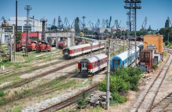 Passenger carriages and locomotives stand on the railway in Varna, Bulgaria