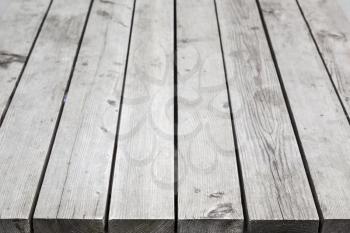 Gray wooden desk. Background photo with perspective effect and selective focus