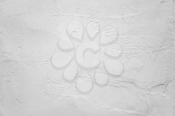 White concrete wall with rough plastering relief pattern, flat photo background texture
