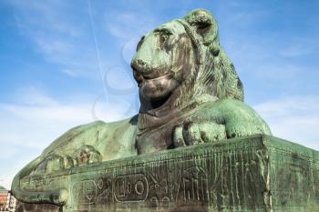 The North Bridge bronze lion. Old statue with egyptian hieroglyphics in the Old Town of Stockholm, Sweden