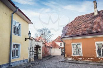 Tallinn Old town, Estonia. Street view with old houses under cloudy sky