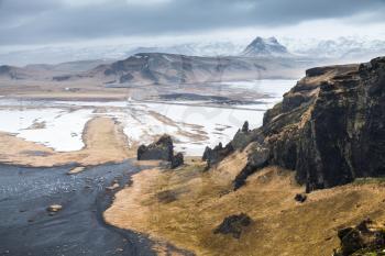 Mountains of Iceland, coastal landscape. Rocks on North Atlantic Ocean coast. Vik district