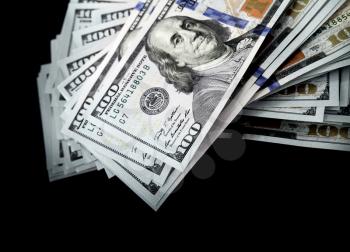United States official currency, bundle of One Hundred Dollars isolated on black background