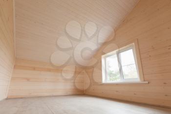 Empty wooden house interior, attic room with window