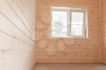 Empty wooden house interior, small room with window