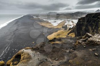 Icelandic coastal landscape. North Atlantic Ocean coast, black sand beach, Vik district, Iceland