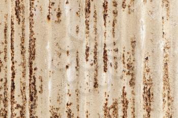 Old rusted corrugated metal wall texture, frontal background photo