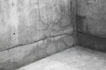 Abstract concrete interior fragment. Empty room, corner of gray stone walls and floor