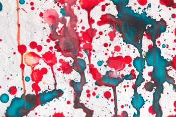 Colorful paint splashes artistic pattern over old paper, background photo texture