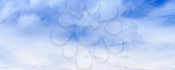 White clouds in blue sky at summer day, natural panoramic photo background texture